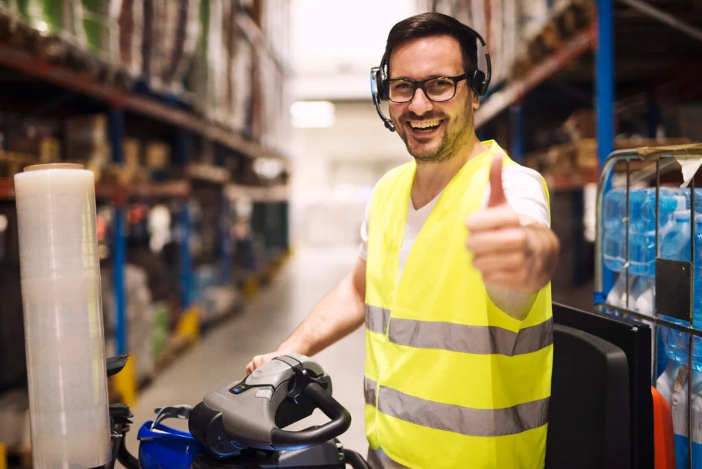 Equipment operator working efficiently in a warehouse for profitable rental services.