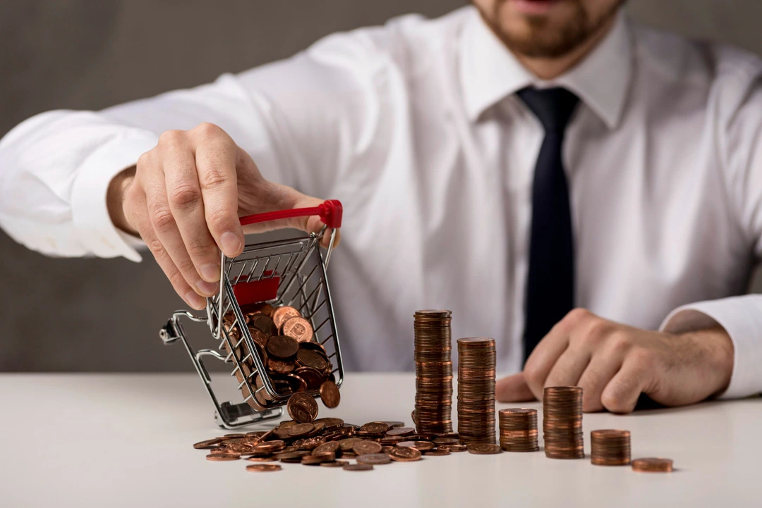 Person pouring coins from a cart onto a table, symbolizing funding ideas for car rentals.