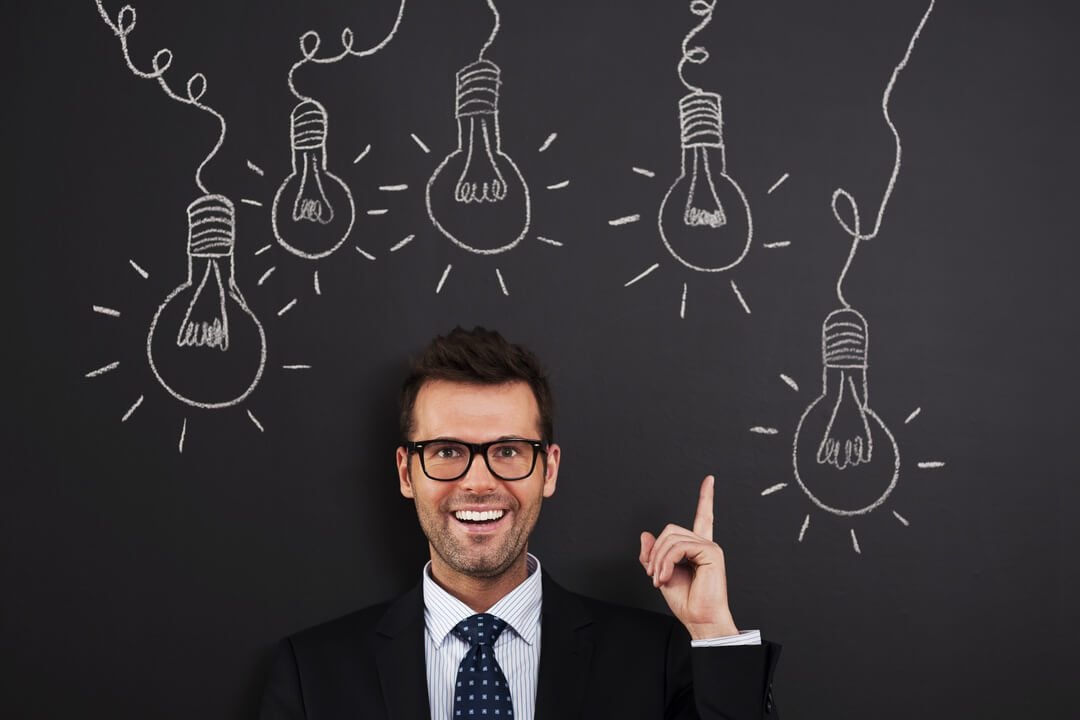 Man with lightbulbs symbolizing rental business growth ideas for 2025.