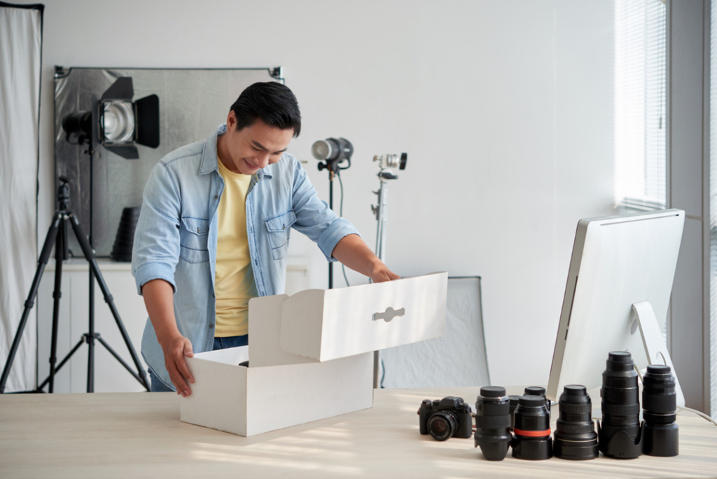 A collection of cameras and accessories, illustrating steps to launch a rental business.