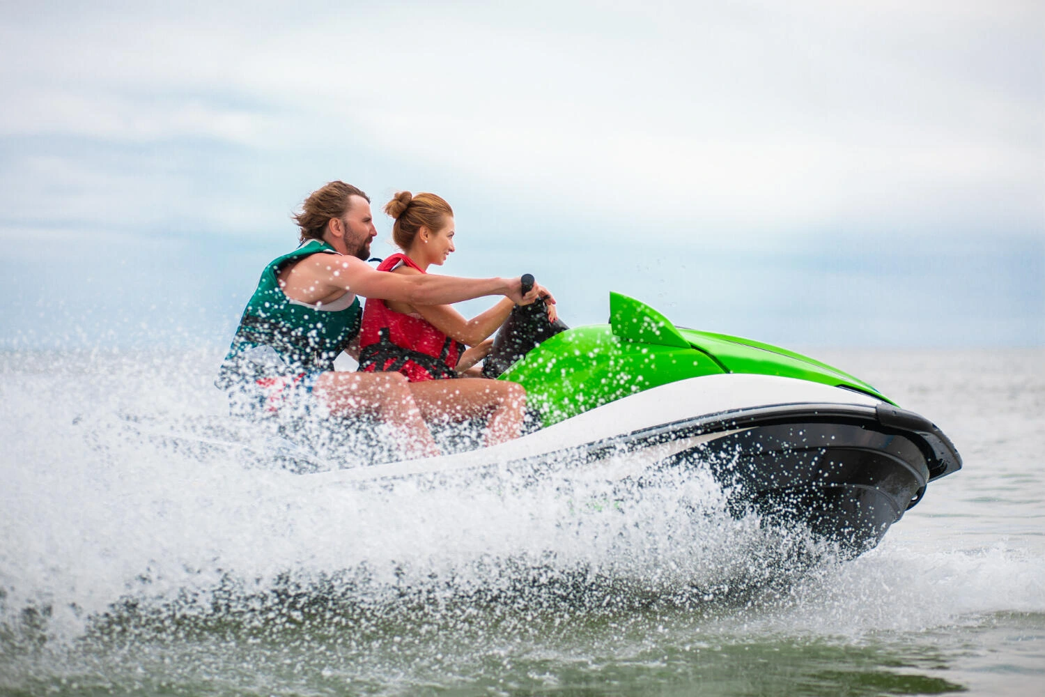 Jet ski speeding over waves, showcasing water sports rental business.