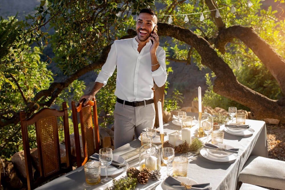 Stylish picnic rental setup with candles and glassware.
