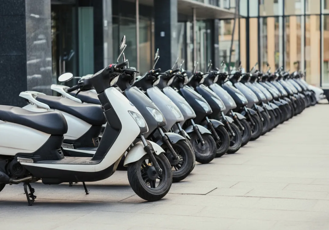 Neatly arranged scooter fleet illustrating vehicle management for rental startups