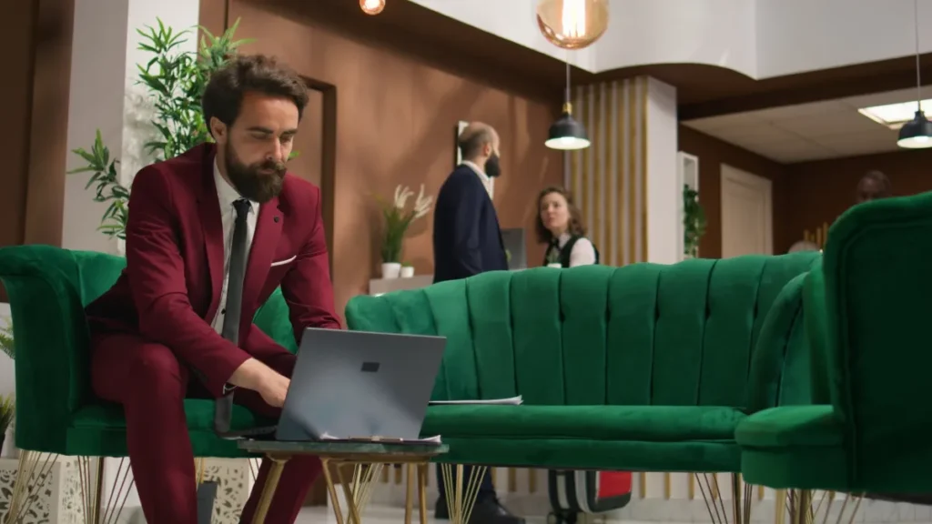 Man in red suit working on business strategy for venue rental services