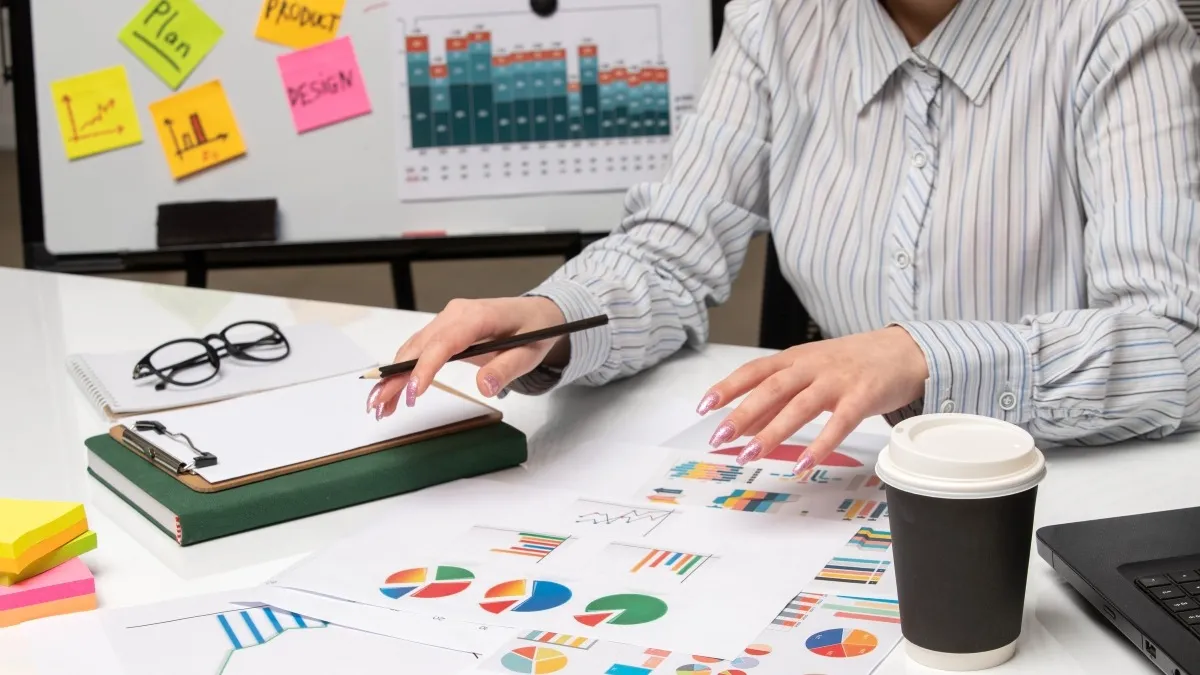 Conducting venue rental market research with printed analytics and graphs