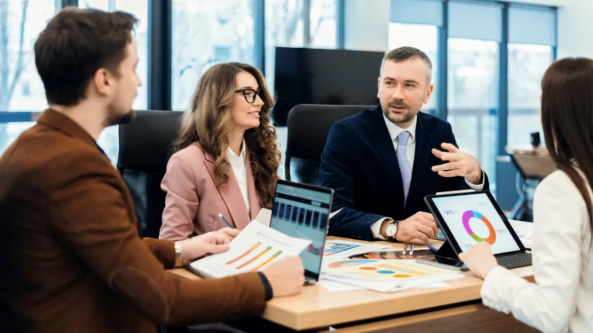 Business team analyzing marketing performance to boost venue bookings
