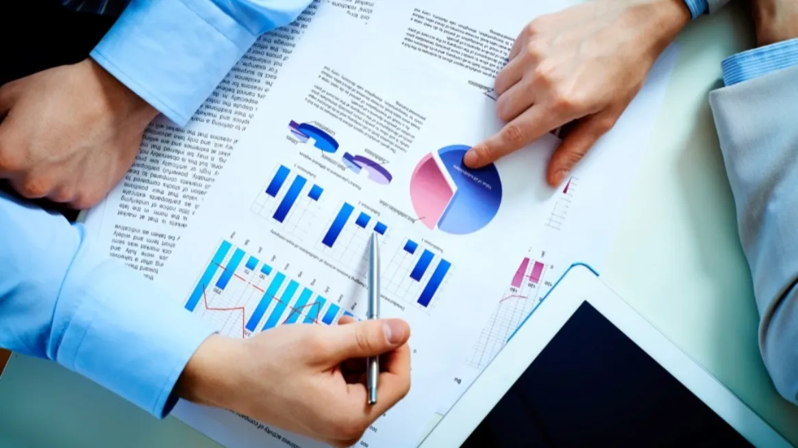 Business planning meeting with paddleboard data