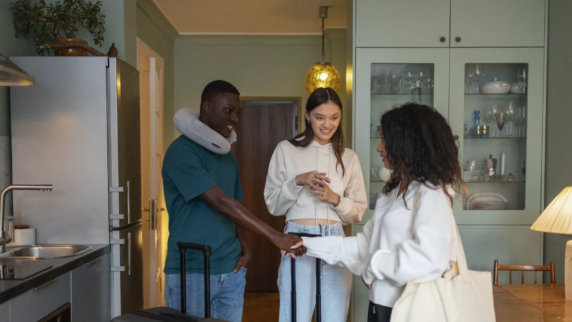 Rental host shaking hands with traveler