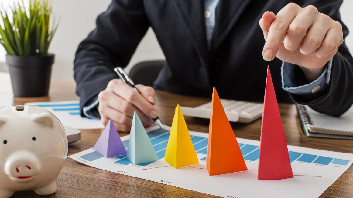 Person analyzing rental pricing with a growth chart