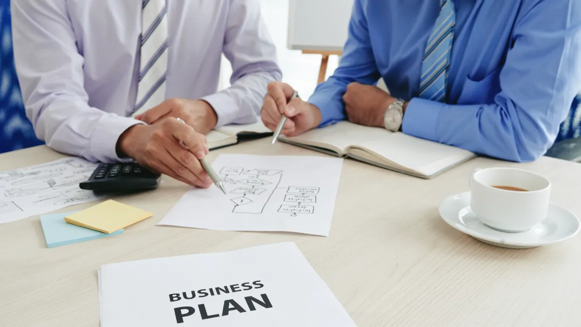 Business partners discussing container rental strategy and legal setup