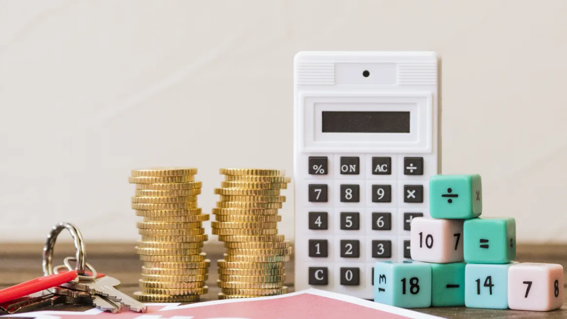 Coins and a calculator representing container rental pricing strategy