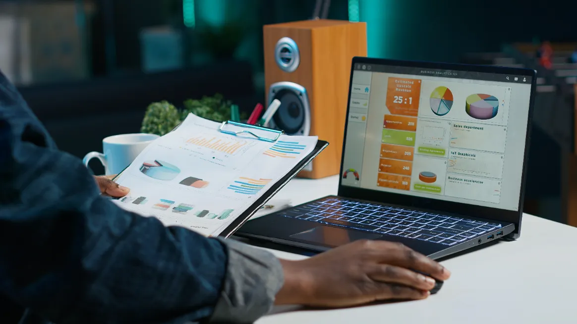 Person analyzing RV rental market data with charts and reports