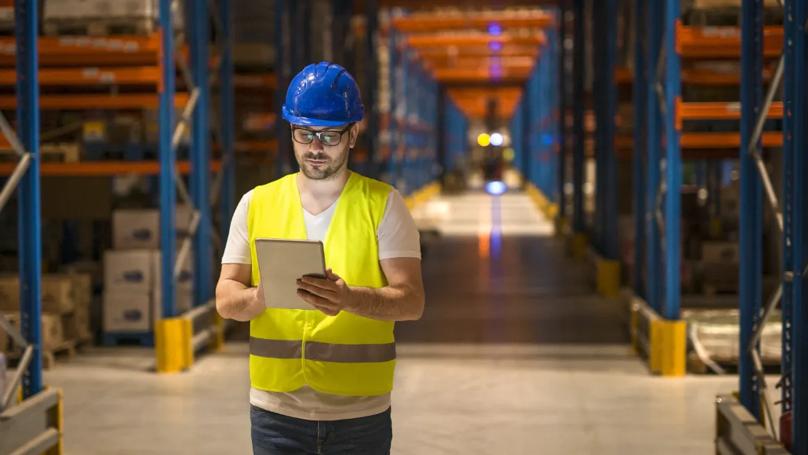 Logistics staff reviewing inventory for container rental business